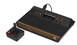 Photo of a classic Atari home video game console with a wired controller